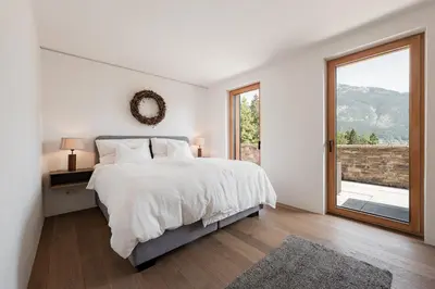 Ein Bett oder Betten in einem Zimmer der Unterkunft Villa Seeblick - Your Austrian Home