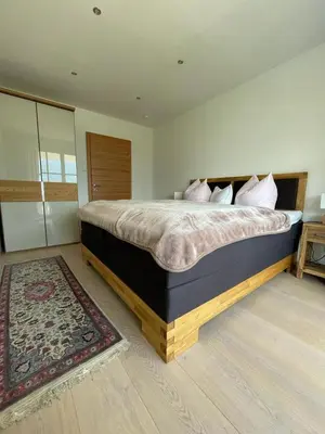 Ein Bett oder Betten in einem Zimmer der Unterkunft Luxury-Suites Traunsee