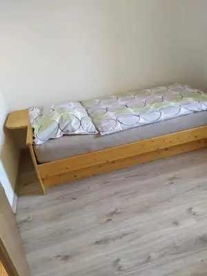 Ein Bett oder Betten in einem Zimmer der Unterkunft Ferienwohnung
