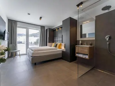 Ein Bett oder Betten in einem Zimmer der Unterkunft Alpenchalet Lambert