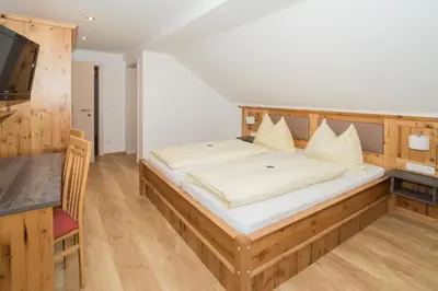 Ein Bett oder Betten in einem Zimmer der Unterkunft Gästehaus Kasbichler