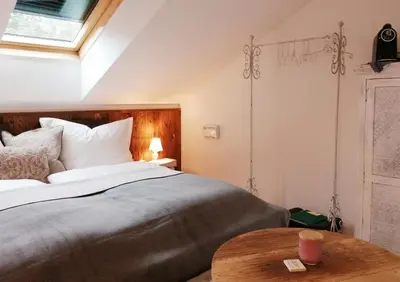 Ein Bett oder Betten in einem Zimmer der Unterkunft Roiderhof Irrsee
