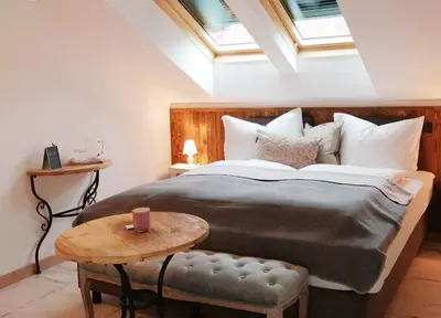 Ein Bett oder Betten in einem Zimmer der Unterkunft Roiderhof Irrsee
