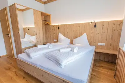 Ein Bett oder Betten in einem Zimmer der Unterkunft Bergidyll 4 by Alpenidyll Apartments