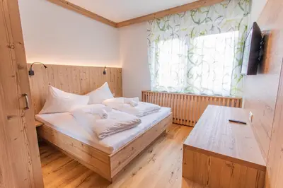 Ein Bett oder Betten in einem Zimmer der Unterkunft Bergidyll 4 by Alpenidyll Apartments