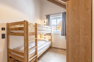 Ein Bett oder Betten in einem Zimmer der Unterkunft AlpiNest Feriendorf Lungau