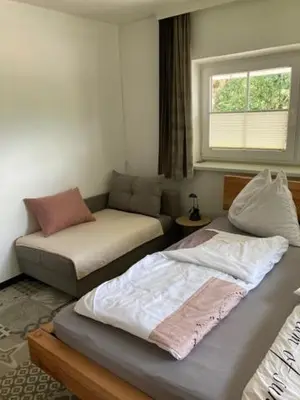 Ein Bett oder Betten in einem Zimmer der Unterkunft Nesterl