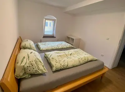 Ein Bett oder Betten in einem Zimmer der Unterkunft Ferienwohnung in Seenähe!