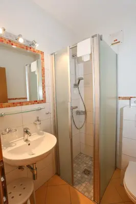 Ein Badezimmer in der Unterkunft Gasthof Leitner - Der Wirt an der Klamm