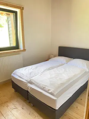 Ein Bett oder Betten in einem Zimmer der Unterkunft Apartment Steinwänd Top 8