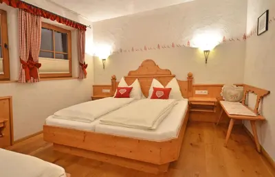 Ein Bett oder Betten in einem Zimmer der Unterkunft Chalet Berghof