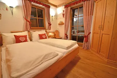 Ein Bett oder Betten in einem Zimmer der Unterkunft Chalet Berghof
