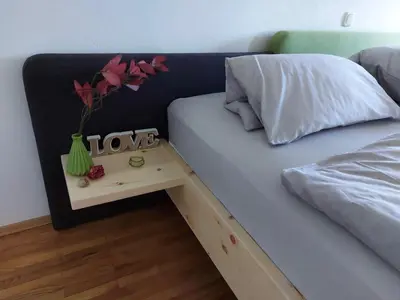 Ein Bett oder Betten in einem Zimmer der Unterkunft Wildkraut's Kräuter- und Alpakabauernhof