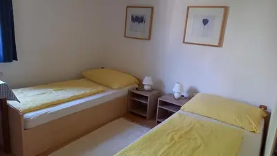 Ein Bett oder Betten in einem Zimmer der Unterkunft Ferienwohnungen Haus Peer