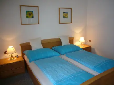 Ein Bett oder Betten in einem Zimmer der Unterkunft Ferienwohnungen Haus Peer