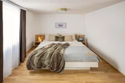 Ein Bett oder Betten in einem Zimmer der Unterkunft MANGGEI-BAU Appartements und Studios