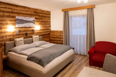 Ein Bett oder Betten in einem Zimmer der Unterkunft Gästehaus Kreischberg - Mayer