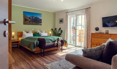 Ein Bett oder Betten in einem Zimmer der Unterkunft Ferienwohnung Leuner
