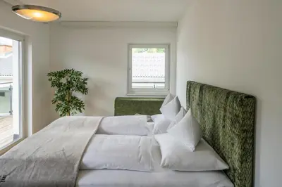 Ein Bett oder Betten in einem Zimmer der Unterkunft Apartment Panoramahirsch