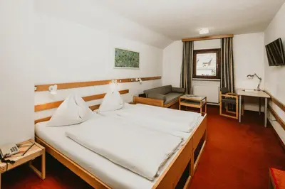 Ein Bett oder Betten in einem Zimmer der Unterkunft Hotel Kernwirt