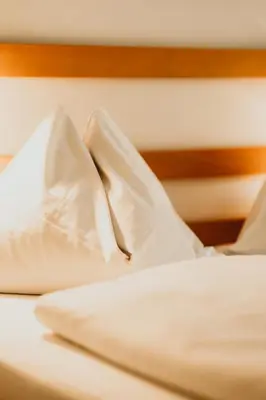 Ein Bett oder Betten in einem Zimmer der Unterkunft Hotel Kernwirt