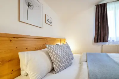 Ein Bett oder Betten in einem Zimmer der Unterkunft Haus Gumpold 2