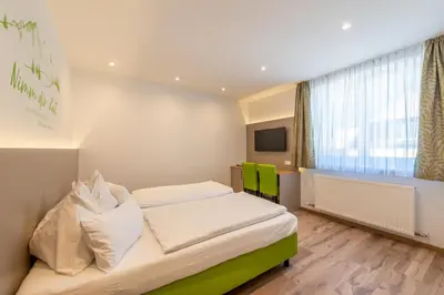 Ein Bett oder Betten in einem Zimmer der Unterkunft Frühstückspension Haus Ahamer