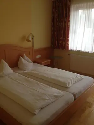 Ein Bett oder Betten in einem Zimmer der Unterkunft Peterwirt