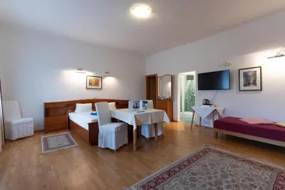 Ein Bett oder Betten in einem Zimmer der Unterkunft Hotel Pension Kandolf