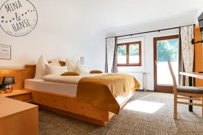 Ein Bett oder Betten in einem Zimmer der Unterkunft Mina&Hansl