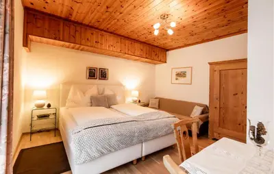Ein Bett oder Betten in einem Zimmer der Unterkunft Ferienwohnung Im Walserhaus