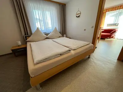 Ein Bett oder Betten in einem Zimmer der Unterkunft Gästehaus Jedinger