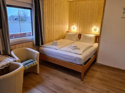Ein Bett oder Betten in einem Zimmer der Unterkunft Haus Alpenrose Obertraun