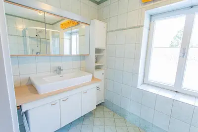 Ein Badezimmer in der Unterkunft Hoamathaus by Alpenidyll Apartments