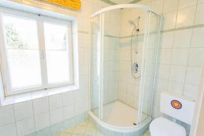 Ein Badezimmer in der Unterkunft Hoamathaus by Alpenidyll Apartments