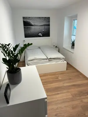 Ein Bett oder Betten in einem Zimmer der Unterkunft Ferienwohnung Gmunden City
