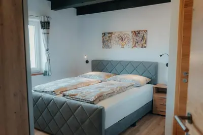 Ein Bett oder Betten in einem Zimmer der Unterkunft Bergblickapartments