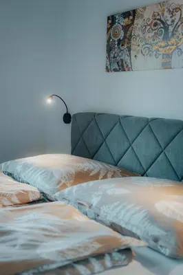 Ein Bett oder Betten in einem Zimmer der Unterkunft Bergblickapartments