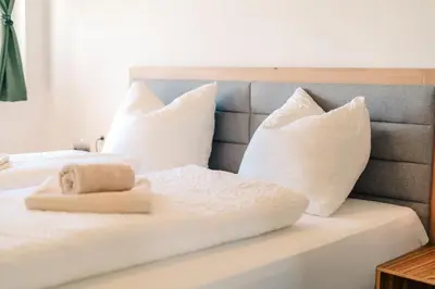 Ein Bett oder Betten in einem Zimmer der Unterkunft Höhenweg Appartement & Ferienwohnung