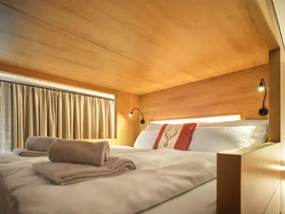 Ein Bett oder Betten in einem Zimmer der Unterkunft The Tauplitz Suites - Mountain Suite A2