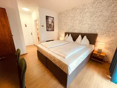 Ein Bett oder Betten in einem Zimmer der Unterkunft Gästehaus am Stadtpark