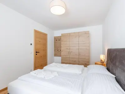 Ein Bett oder Betten in einem Zimmer der Unterkunft Lärchenhof Top 203