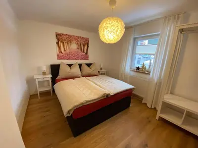 Ein Bett oder Betten in einem Zimmer der Unterkunft Herzzeit Apartments