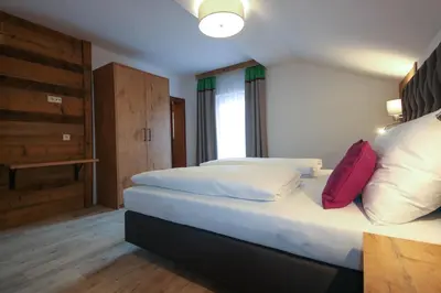 Ein Bett oder Betten in einem Zimmer der Unterkunft Kia Ora Hotel Restaurant