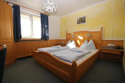 Ein Bett oder Betten in einem Zimmer der Unterkunft Landgasthof Spitzerwirt