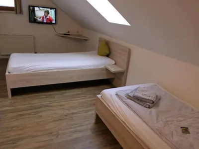 Ein Bett oder Betten in einem Zimmer der Unterkunft Landgasthof Spitzerwirt