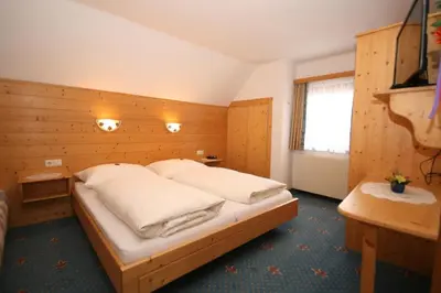 Ein Bett oder Betten in einem Zimmer der Unterkunft Haus Meissnitzer