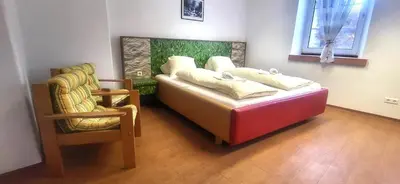 Ein Bett oder Betten in einem Zimmer der Unterkunft Hoamathaus II by Alpenidyll Apartments