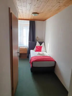 Ein Bett oder Betten in einem Zimmer der Unterkunft Weisses Rössel-Cavallo Bianco