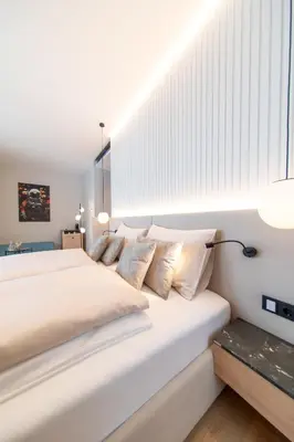 Ein Bett oder Betten in einem Zimmer der Unterkunft Apollo AchtQuartier Das Hotel am Mondsee